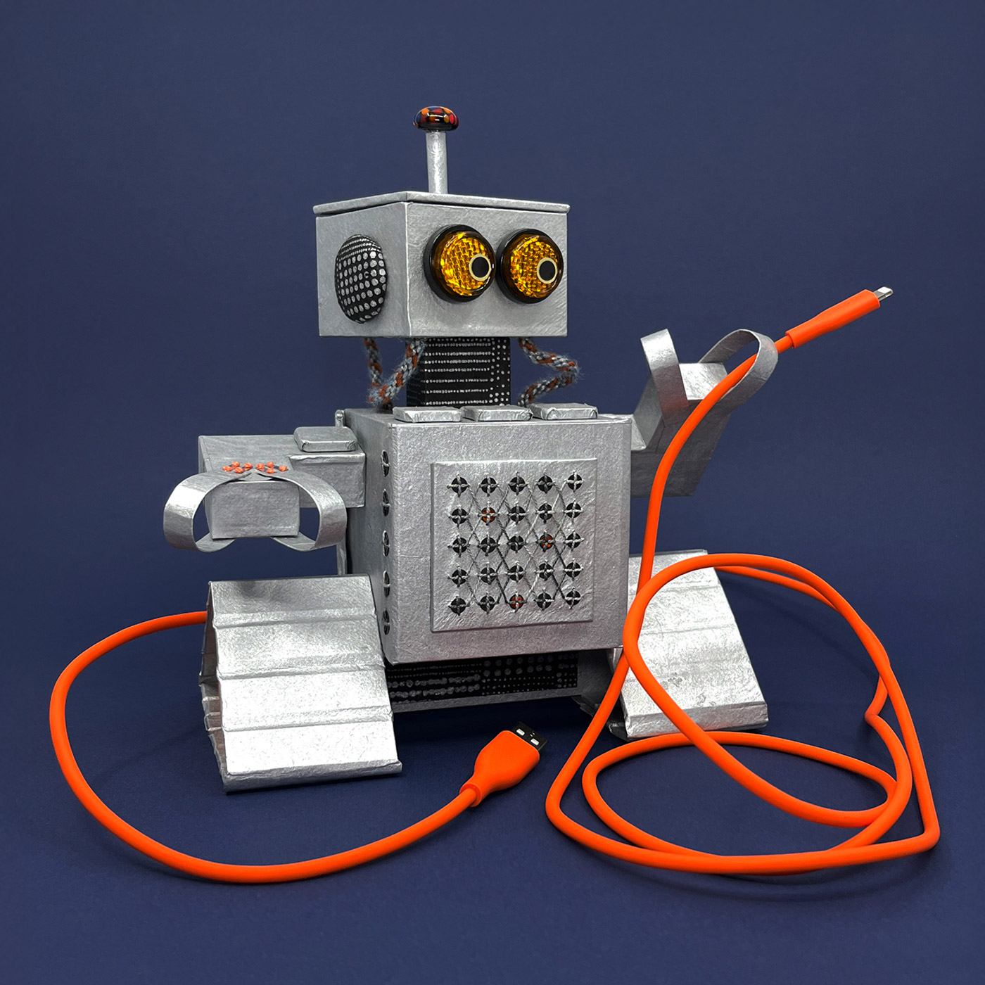 A silver retro-style robot named MLEM, holding an orange charging cable against a dark blue background.