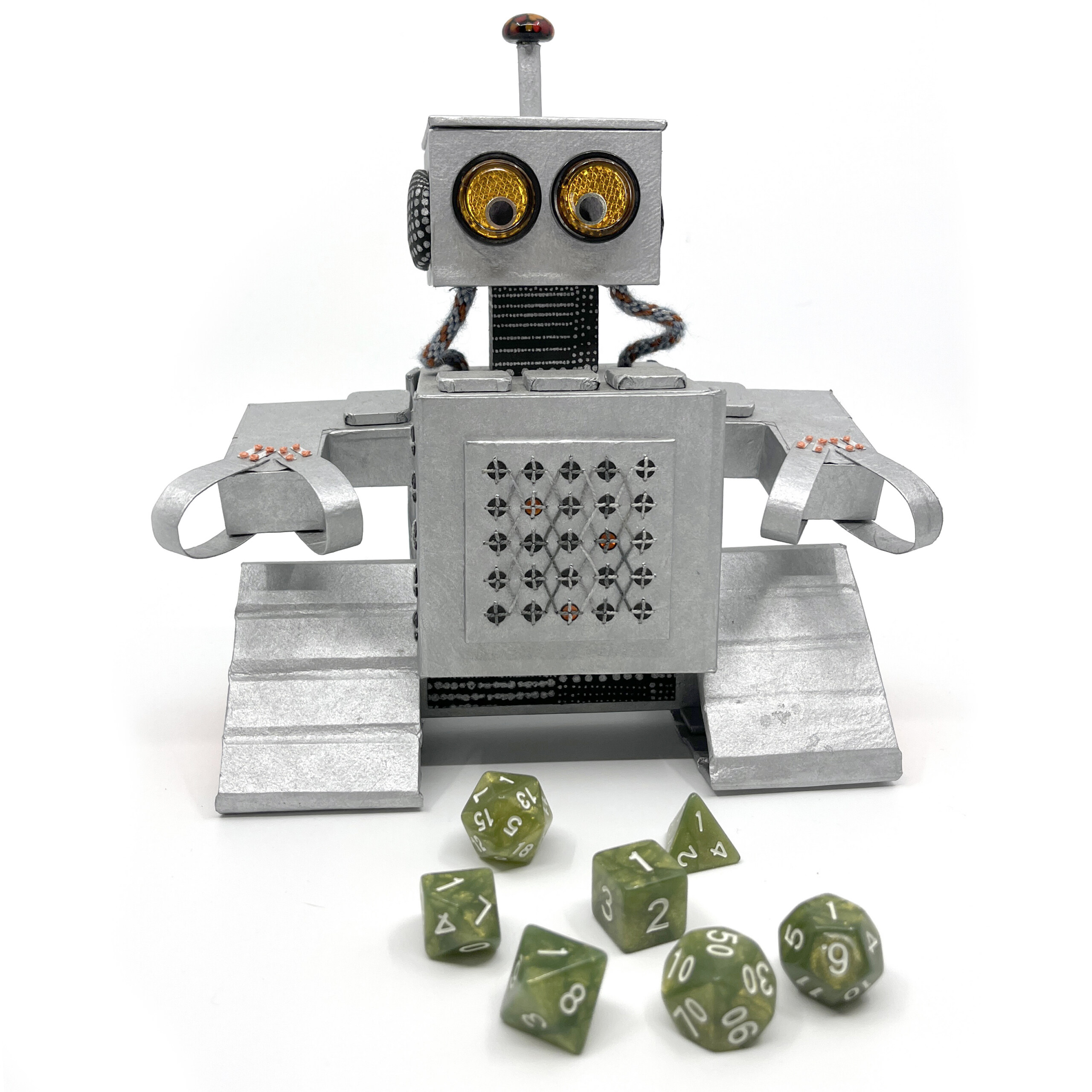 Milo the robot playing with an assortment of dice, D4 up to D20