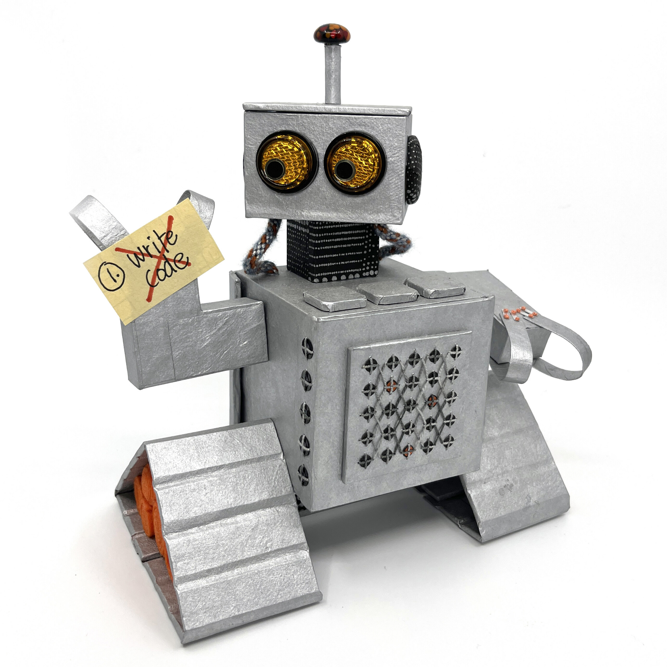 Milo the robot holding a sticky note that says "1. write code" with a red "X" drawn over the note.